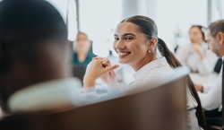 People sat around table in meeting