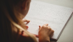 Person reading braille